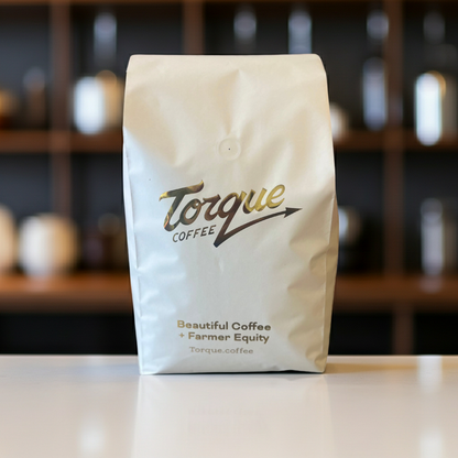 Torque Coffee bag on a counter with a blurred background